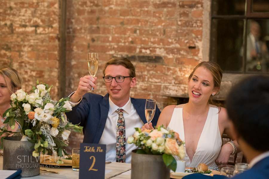 Couple Toasts Senate Garage Reception